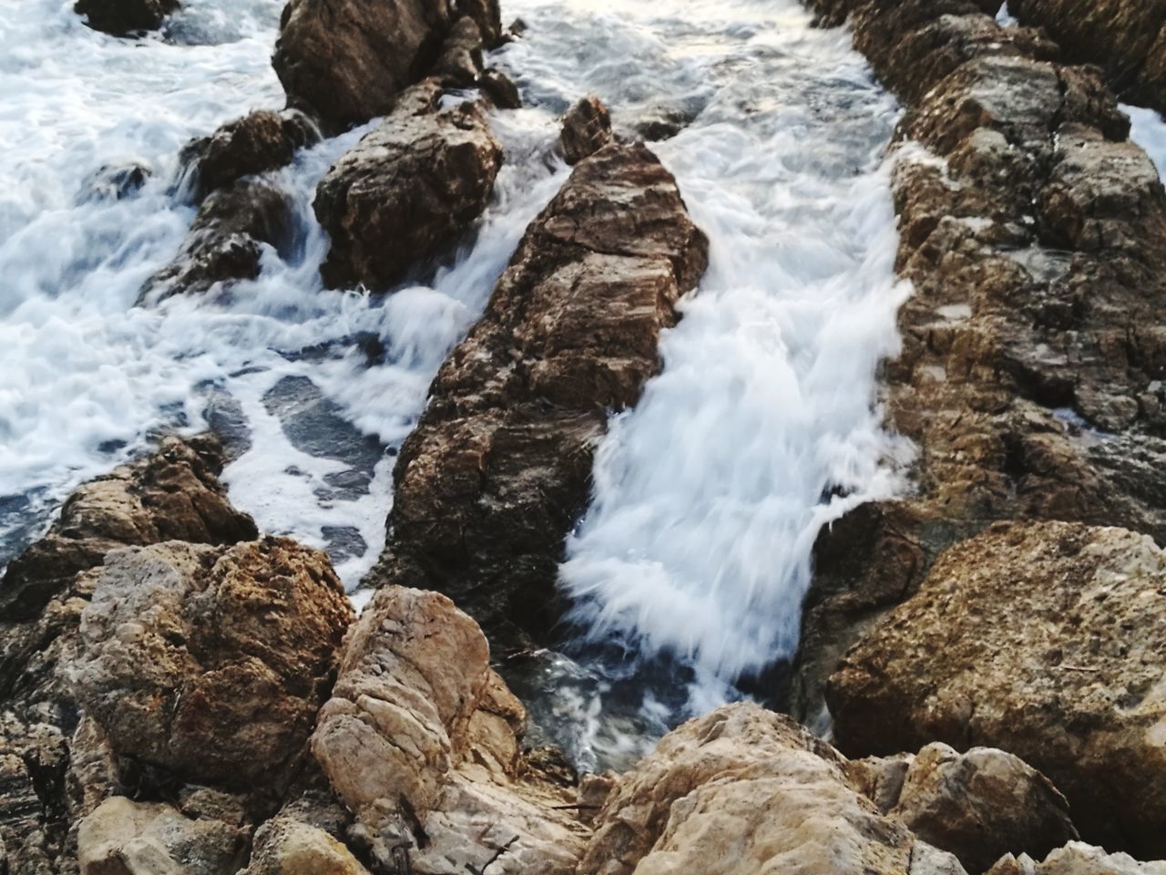 motion, water, rock - object, long exposure, nature, waterfall, beauty in nature, surf, blurred motion, rock formation, rock, no people, wave, scenics, sea, power in nature, outdoors, splashing, day, tranquil scene, hitting, rapid, tranquility, crash, force