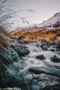 Scenic view of snowcapped mountains against sky