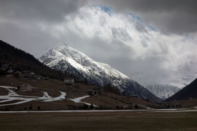 Scenic view of snowcapped mountains against sky