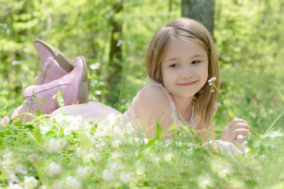 Portrait of smiling girl with plants