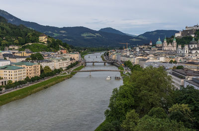 High angle view of river amidst buildings in city