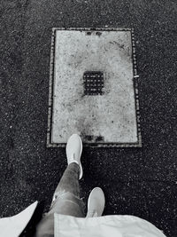 Low section of person walking on street