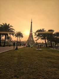 Palm trees and miniature eiffel tower in city 