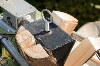 High angle view of rusty padlock on wood