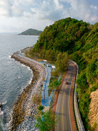 High angle view of road by sea against sky