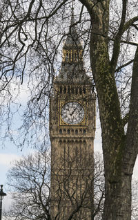 Low angle view of clock tower against sky