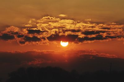 Scenic view of dramatic sky during sunset