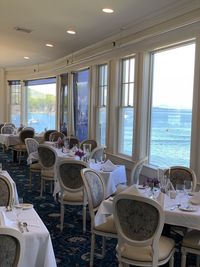 Empty chairs and tables in restaurant