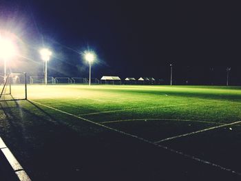 View of illuminated field at night