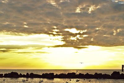 Scenic view of sea against cloudy sky