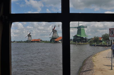 Scenic view of sea against sky seen through window