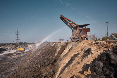 Low angle view of construction site against sky