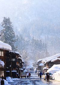 Group of people on snow covered city