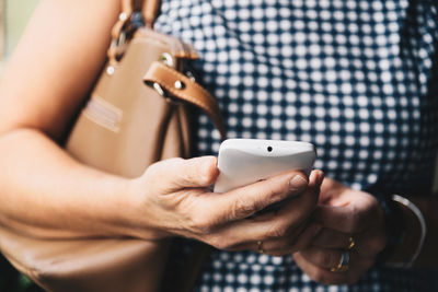 Close-up of woman using mobile phone