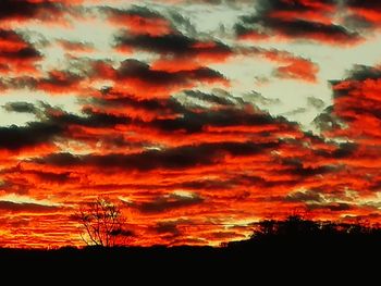 Low angle view of dramatic sky during sunset