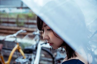 Portrait of young woman looking away