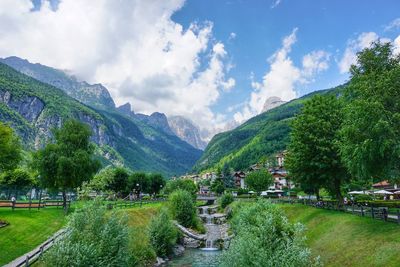 Scenic view of green mountains against sky