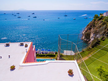 High angle view of swimming pool by sea against sky