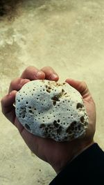 Close-up of hand holding ice cream