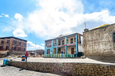 Houses in town against sky