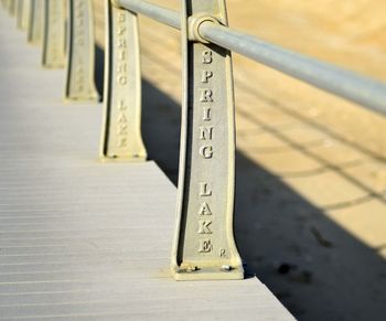 Surface level of cropped footbridge along railing