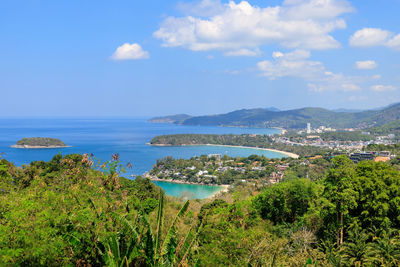 Panoramic shot of townscape by sea against sky