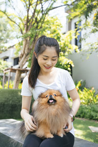 Portrait of woman with dog