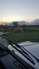 Scenic view of field against sky during sunset