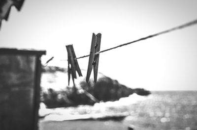 Close-up of barbed wire against clear sky