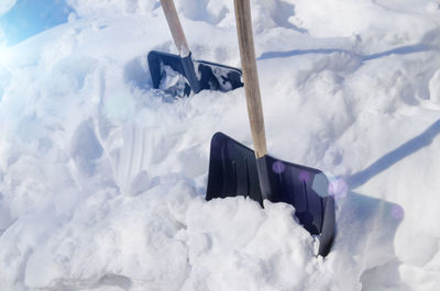 Shovels stuck in snowdrift