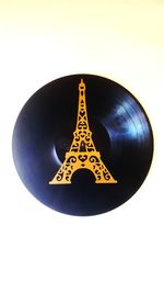 Close-up of illuminated lighting equipment against white background