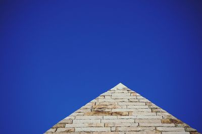 Low angle view of historical building against clear blue sky