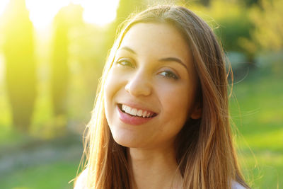 Close-up portrait of a smiling young woman