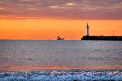 Scenic view of sea against sky during sunrise