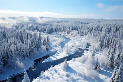 Snow covered landscape against sky