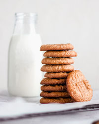 Close-up of bread on table against white background