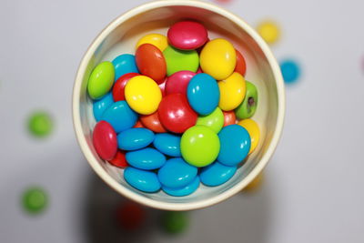 High angle view of multi colored candies in bowl