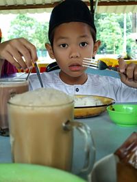 Portrait of boy holding ice cream