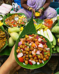 Midsection of woman holding food