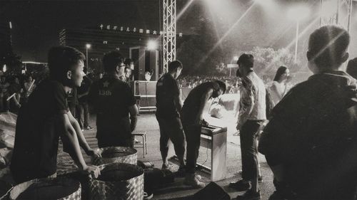 Group of people standing at night