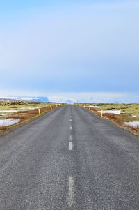 Empty road along landscape