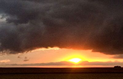 Scenic view of dramatic sky during sunset