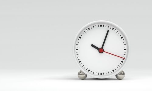 Close-up of clock on white background