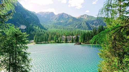 Scenic view of lake and mountains against sky