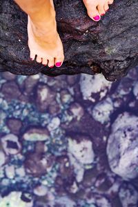 Low section of woman on rock