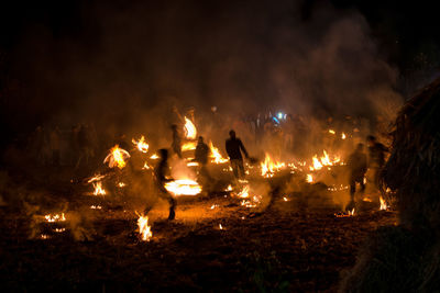 Group of people on field at night