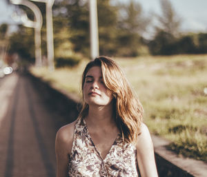 Portrait of beautiful young woman looking away