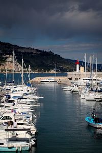 Boats moored at harbor