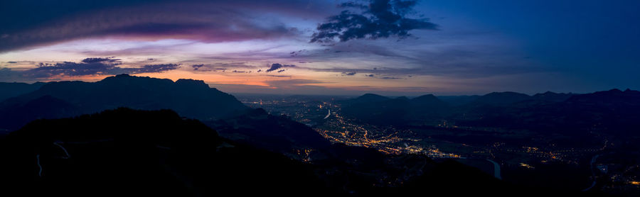 Scenic view of silhouette mountains against sky at sunset