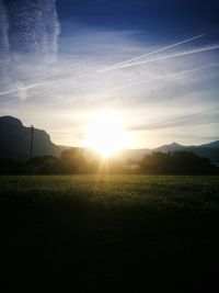 Scenic view of field against sky during sunset